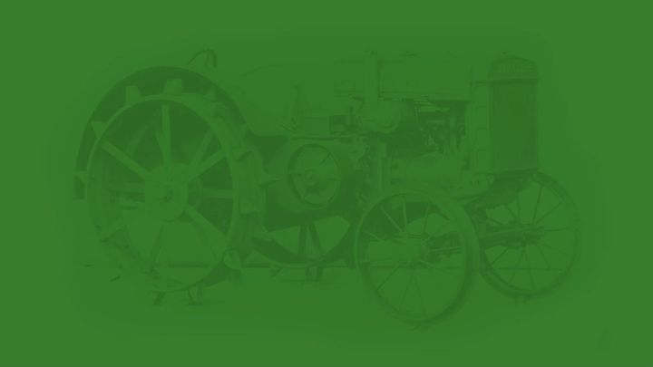 A green banner with a faint image of a Waterloo Boy tractor