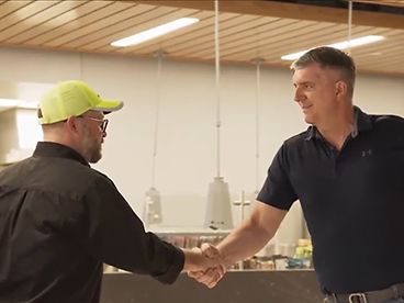Erik shaking hands with his mentor, Kurt